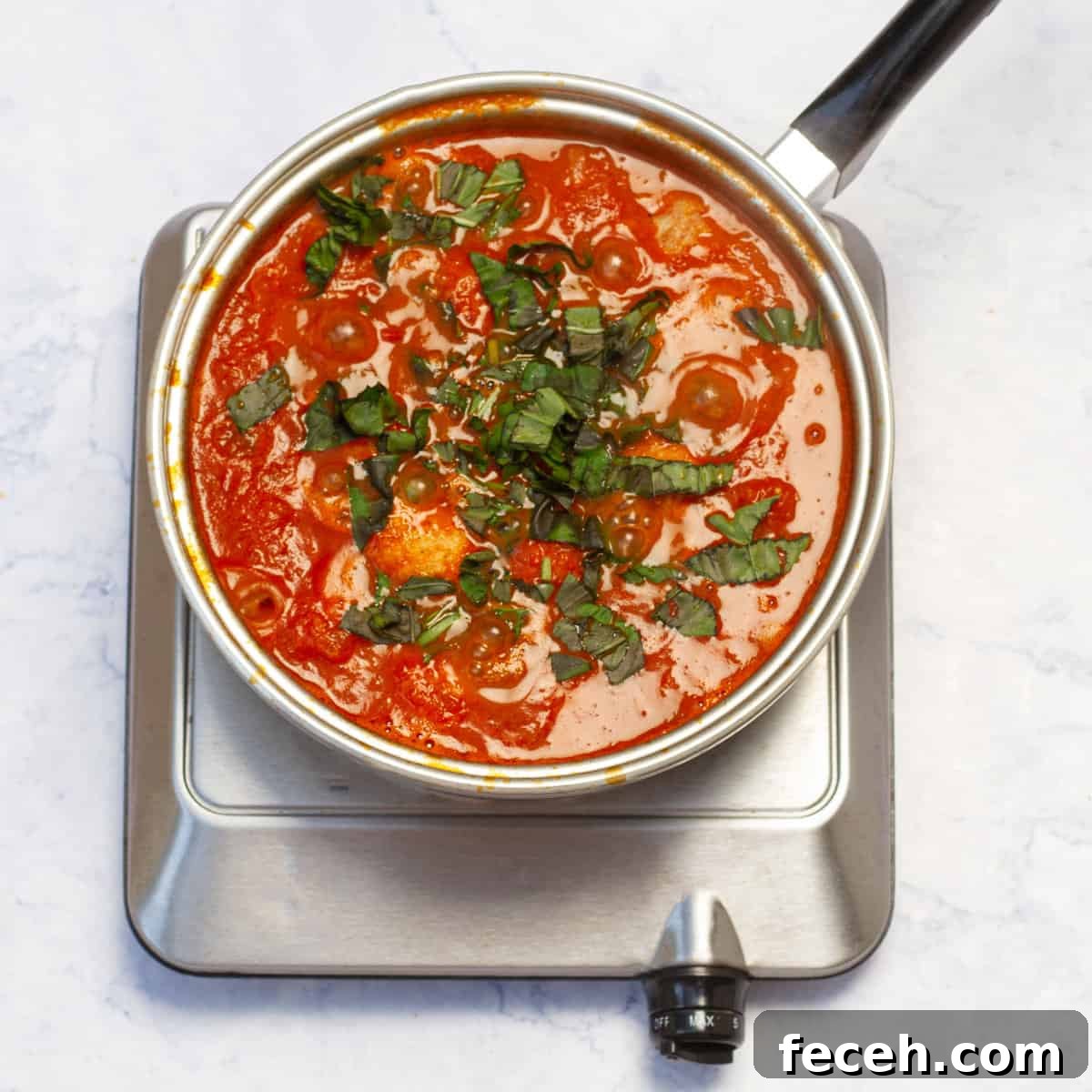 marinara sauce with water into the skillet with the meatballs