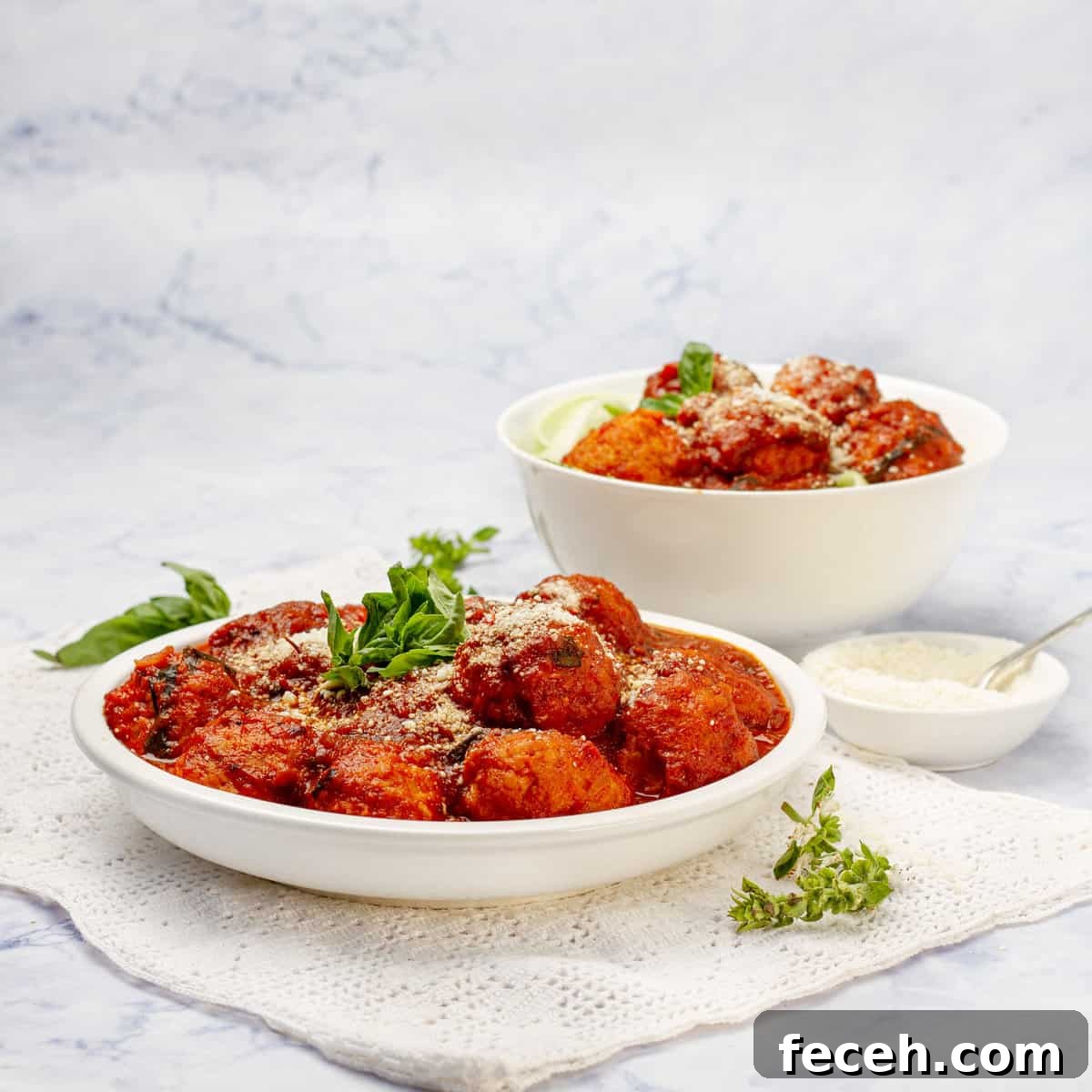 Pesto Chicken Meatballs in a bowl and plate
