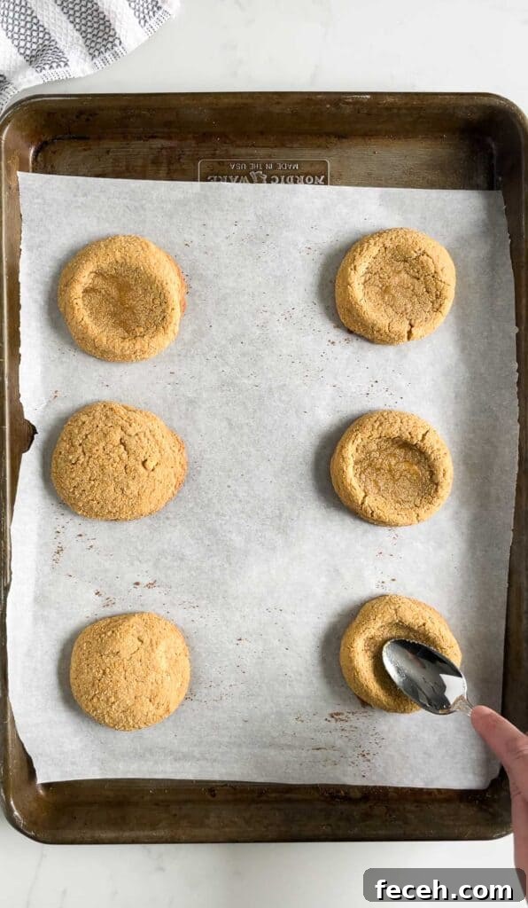 forming a thumbprint in graham cracker cookies