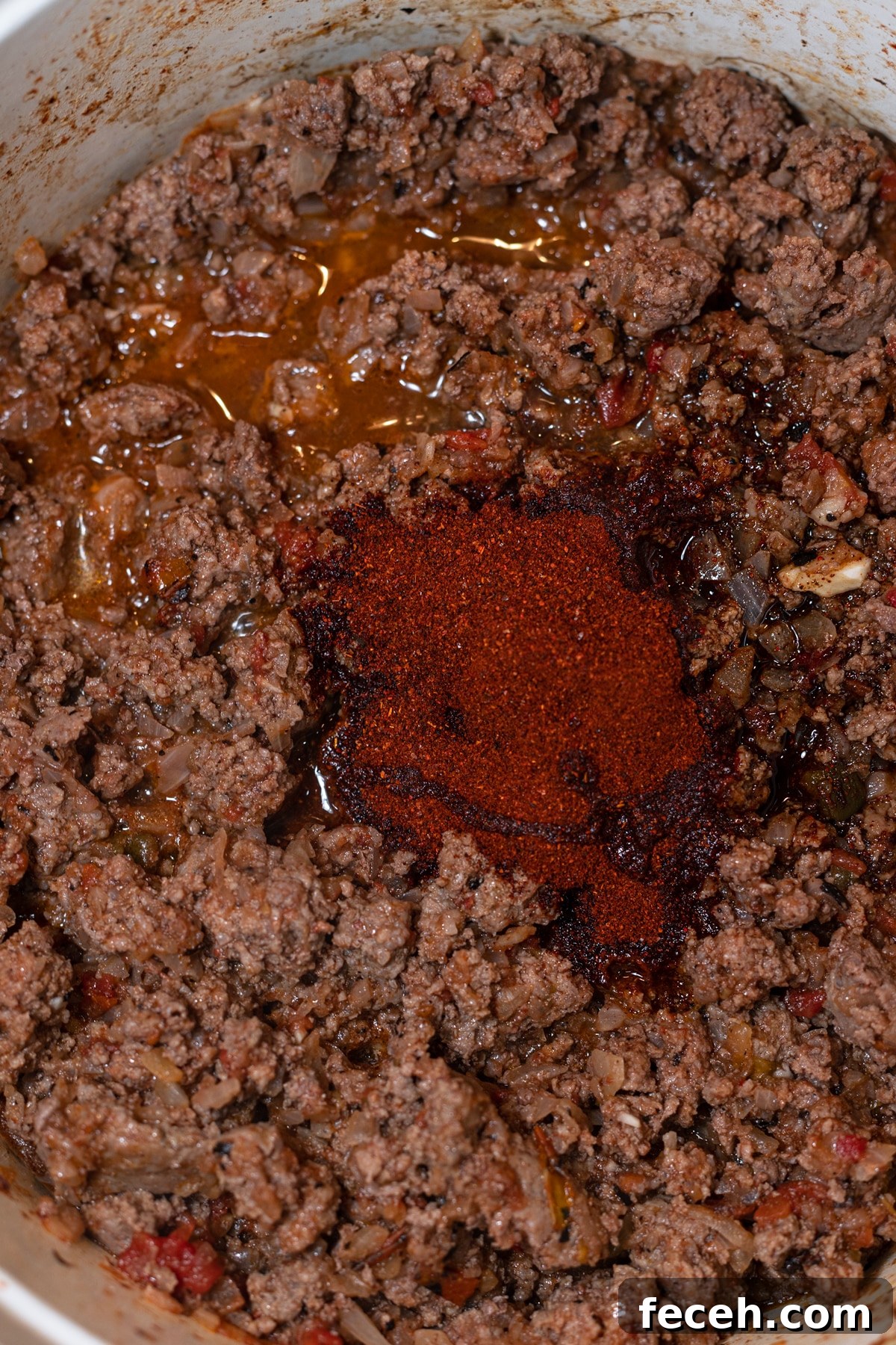 Hearty Three-Bean Chili Recipe: Simple Weeknight Dinner 7 Seasonings in a pot with ground beef.