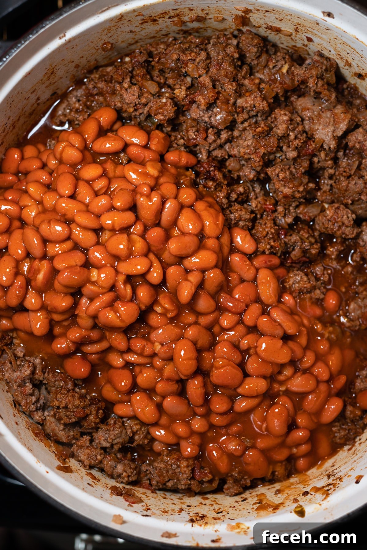 Hearty Three-Bean Chili Recipe: Simple Weeknight Dinner 8 Beans in a pot with ground beef simmering.
