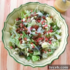 Summer Fennel Salad with Feta, Watermelon and Toasted Pecans 15 Summer fennel salad with shaved fennel, feta cheese, candied pecans, and watermelon in a large bowl.