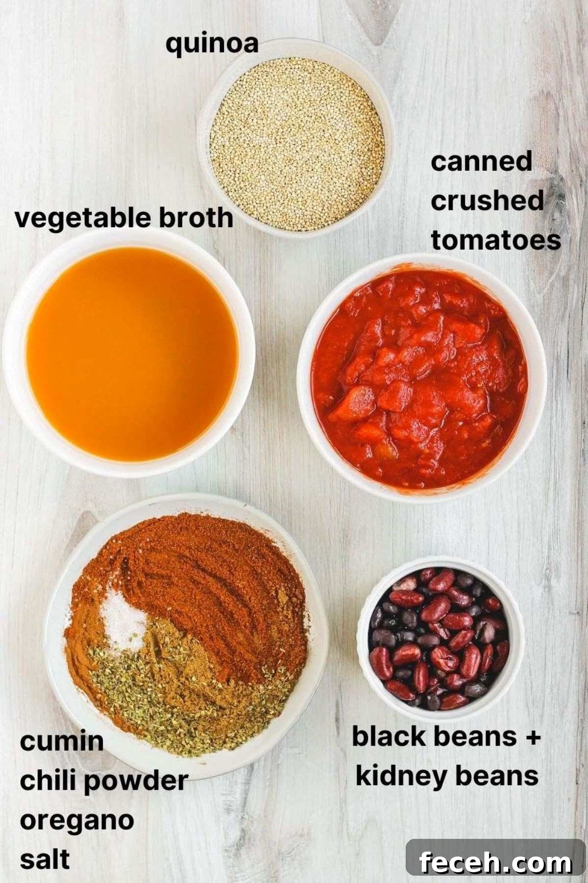 Labeled ingredients for canned items and seasonings for vegan sweet potato chili.
