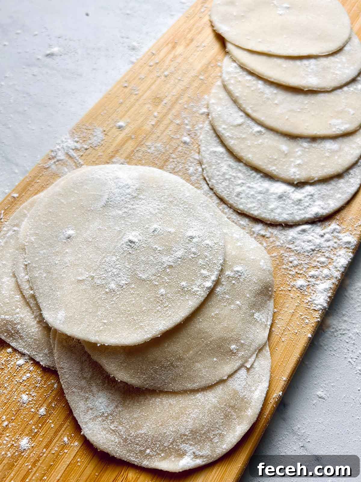 Homemade Gyoza Wrappers Recipe for Perfect Dumplings 2 gyoza wrappers on wooden board