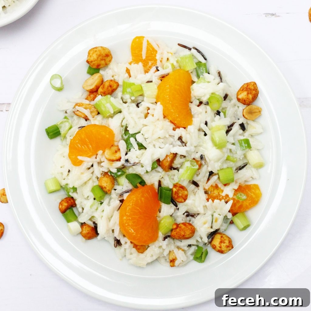 Rice salad with mandarins, spring onions and peanuts