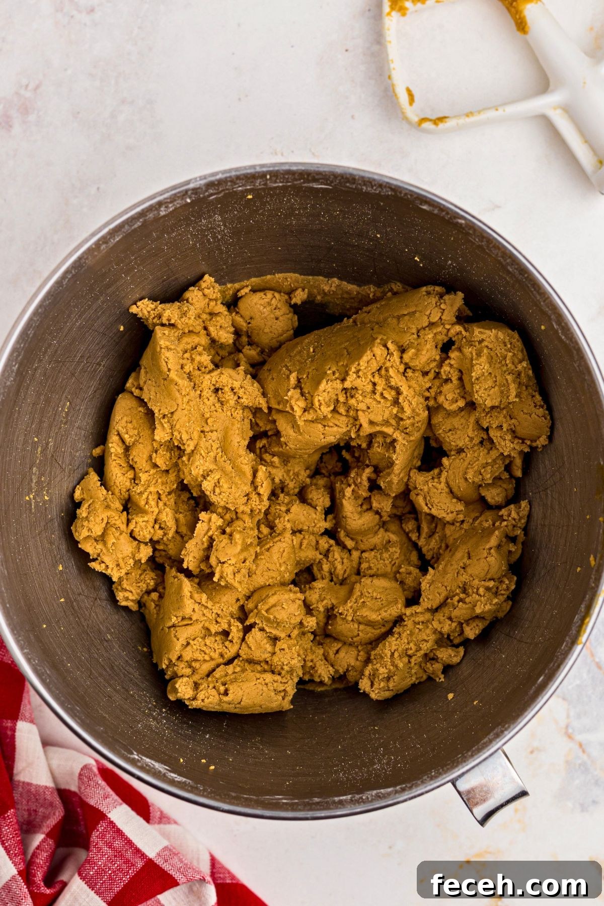 Classic Gingerbread Cookie Recipe for Soft, Spiced Cookies 6 Light and fluffy gingerbread cookie dough in a silver mixing bowl.