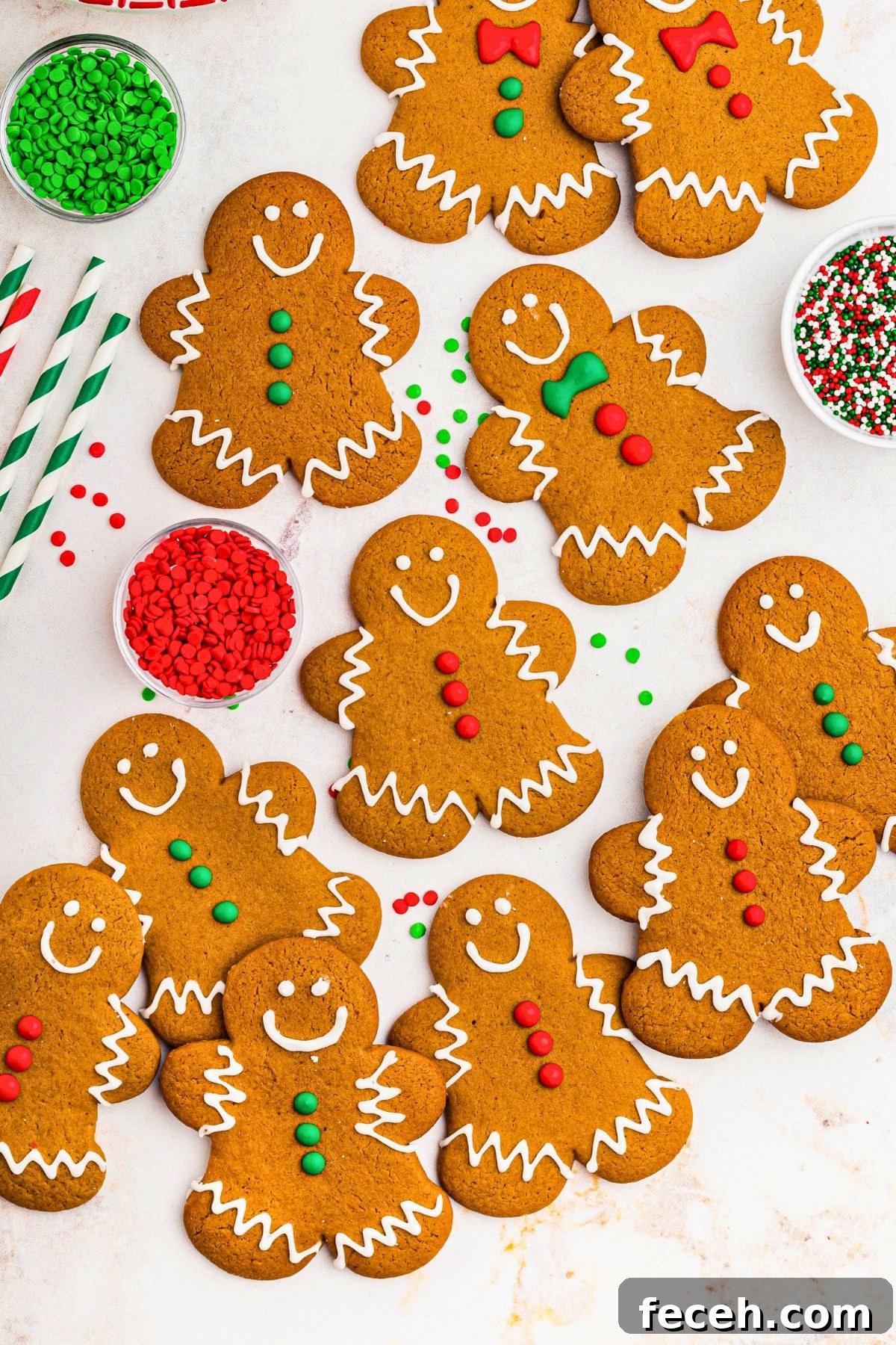 Classic Gingerbread Cookie Recipe for Soft, Spiced Cookies 10 Golden gingerbread cookies in the shape of gingerbread men, decorated with red, white, and green icing.