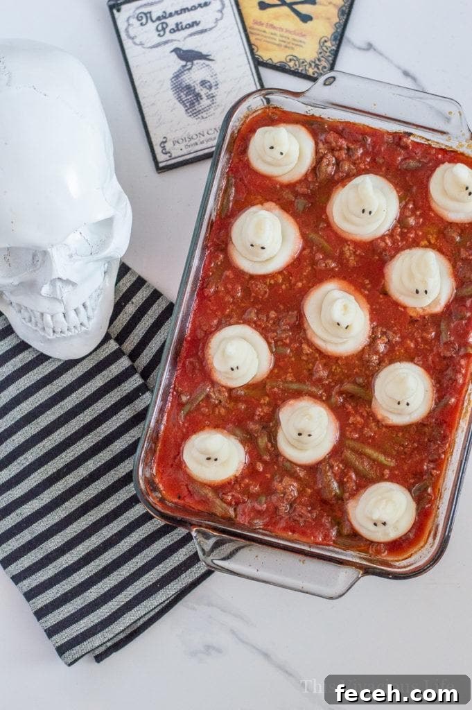 Halloween dinner of spooky shepherds pie in a glass dish