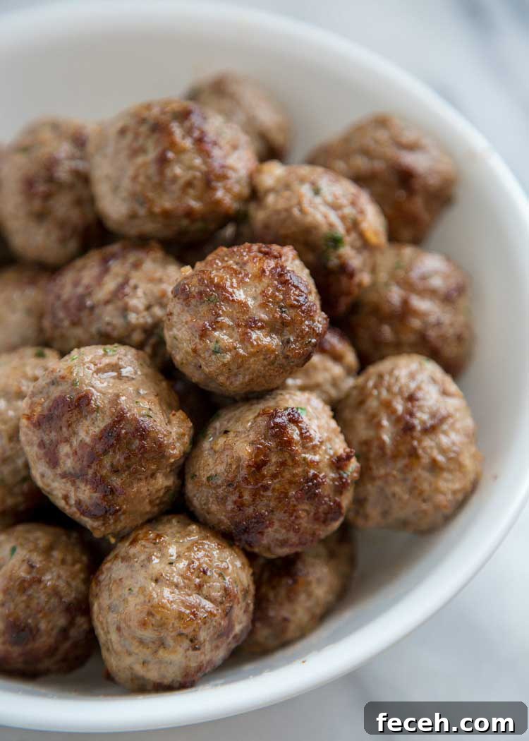 browned meatballs in white bowl