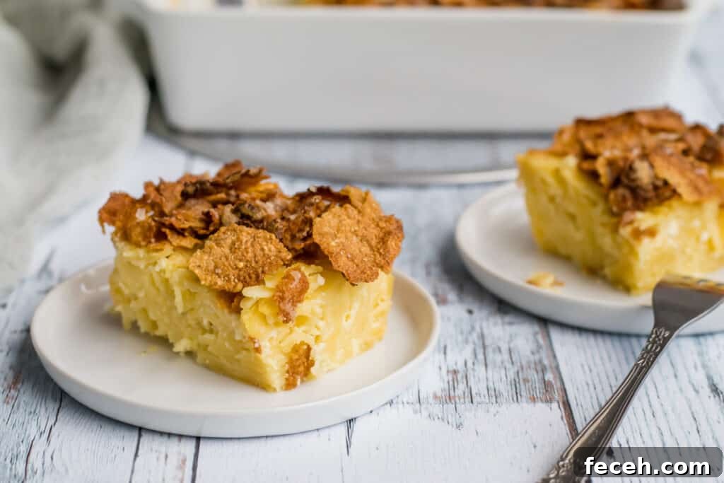 two pieces of noodle  kugel on white plates