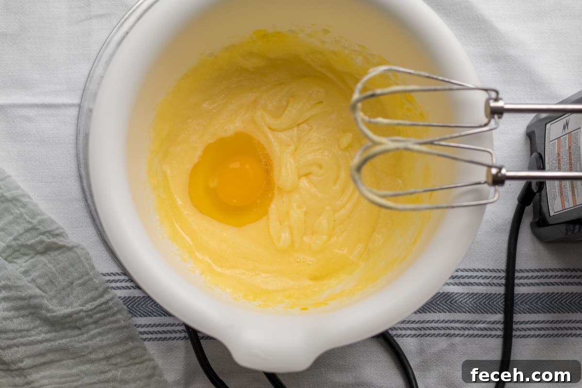 eggs being added to kugel custard