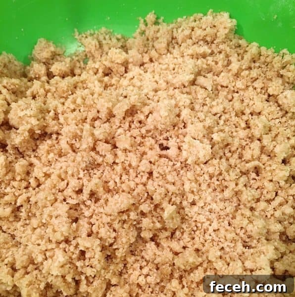 crumb topping mixture in bowl ready to go on top of pie