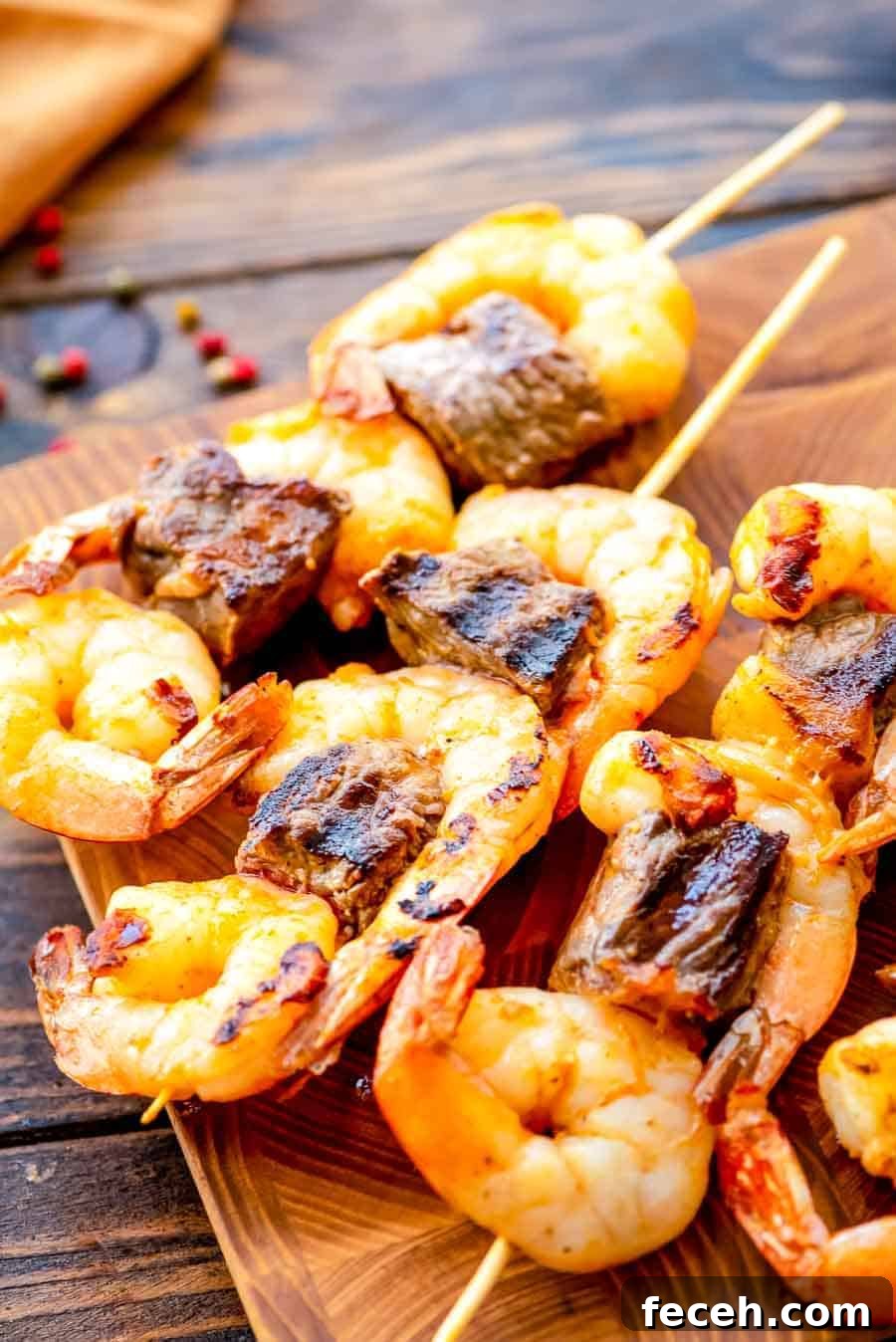 Grilled Steak and Shrimp Kabobs on cutting board