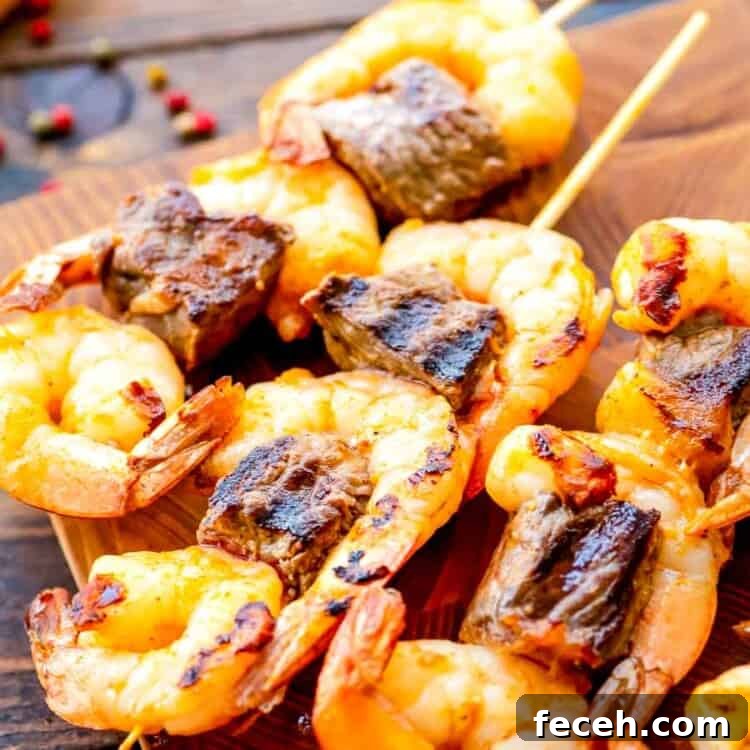 Grilled Steak and Shrimp Kabobs on cutting board