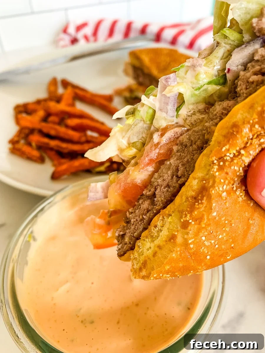 In-N-Out Spread Copycat Recipe: How to Make the Famous Sauce 7 Dipping a burger into hamburger sauce.