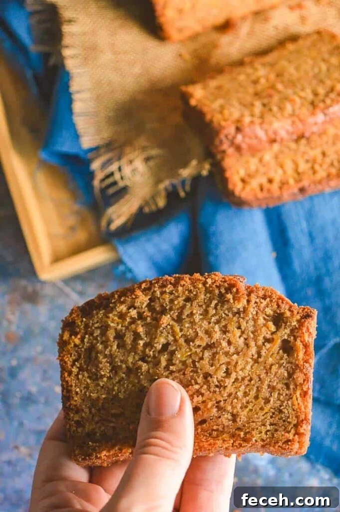 Moist Vegan Pumpkin Bread Recipe for Fall Baking 3 A slice of a light brown quickbread