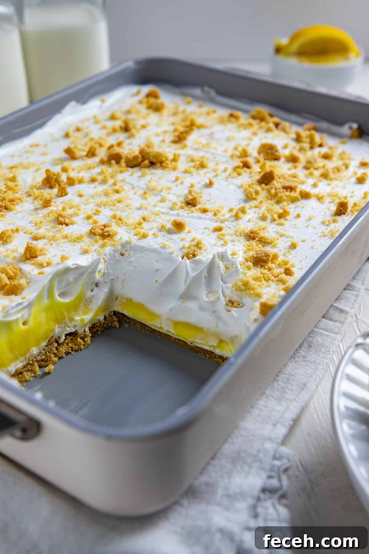 Creamy Lemon Lush Dessert Recipe for Every Occasion 2 A 9 by 13-inch pan of Lemon Lush with one serving removed.