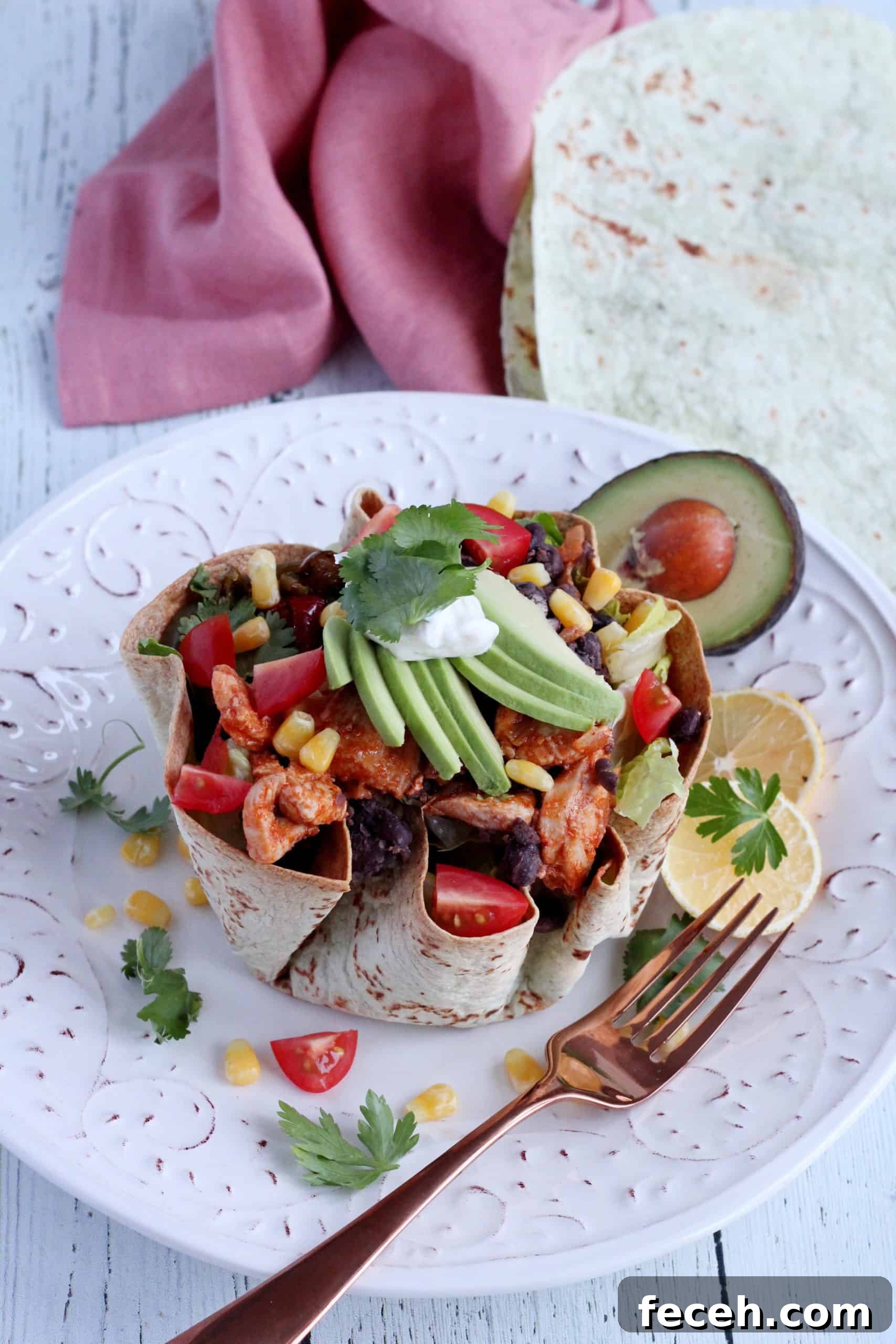 Tortilla bowl with chicken salad inside.