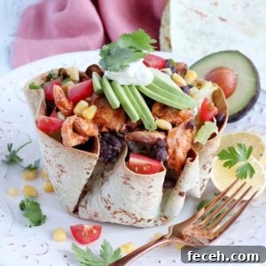 Tex Mex bowl filled with chicken and salad.