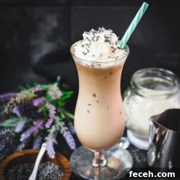 Iced Lavender Latte Recipe: How to Make a Floral Cold Coffee Drink 13 Gorgeous Hurricane glass, filled with crushed lavender iced latte, topped with whipped cream and sprinkled with lavender buds. Served with a turquoise white striped drinking straw.