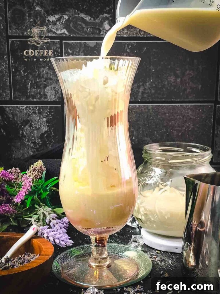 Iced Lavender Latte Recipe: How to Make a Floral Cold Coffee Drink 6 Top with milk.