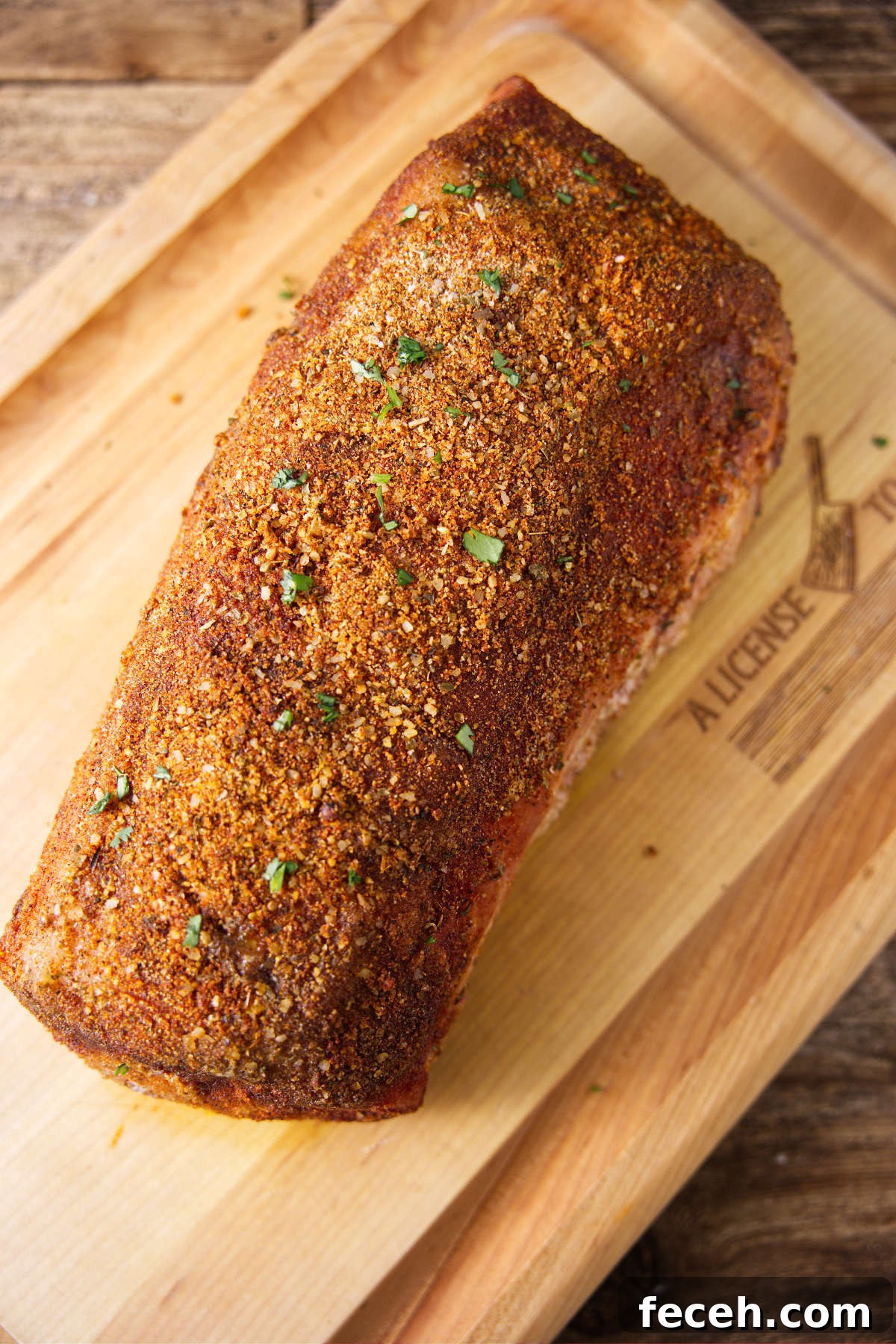 Pork Loin vs Pork Shoulder: Which Cut Should You Cook Tonight? 5 Smoked pork loin resting on wood cutting board.