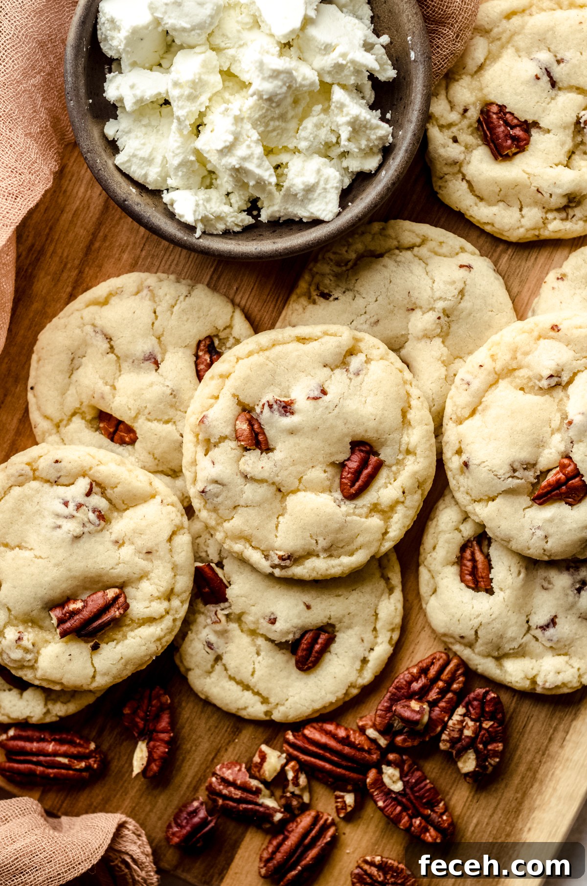 Aerial photo of maple pecan goat cheese sugar cookies on a wooden board.