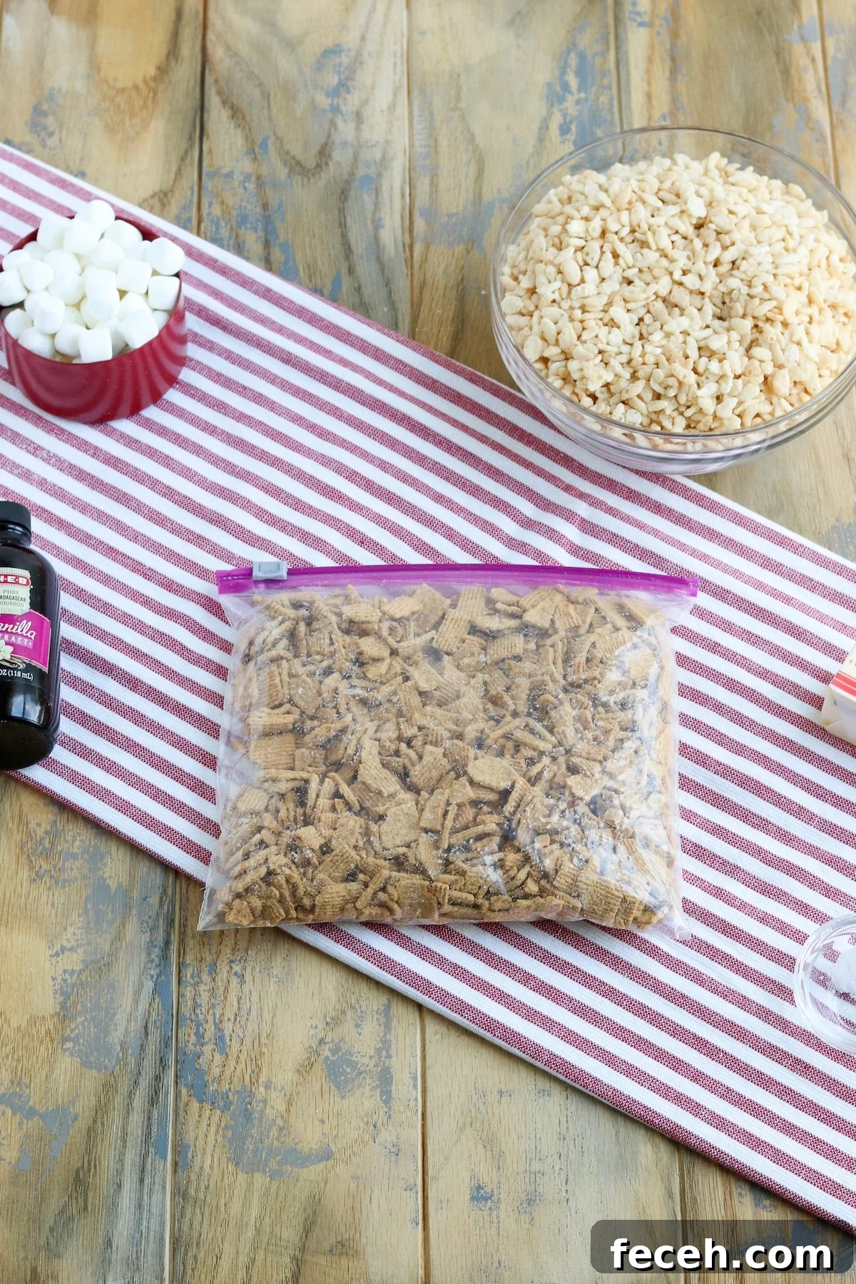Golden Graham Rice Krispie Treats Recipe — Crispy Marshmallow Squares 3 ingredient shot with marshmallows, crushed graham cereal, Rice Krispies, butter and salt