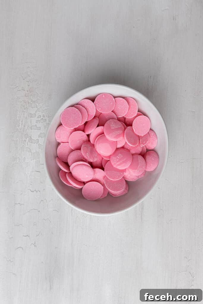 Pink candy melts in a bowl