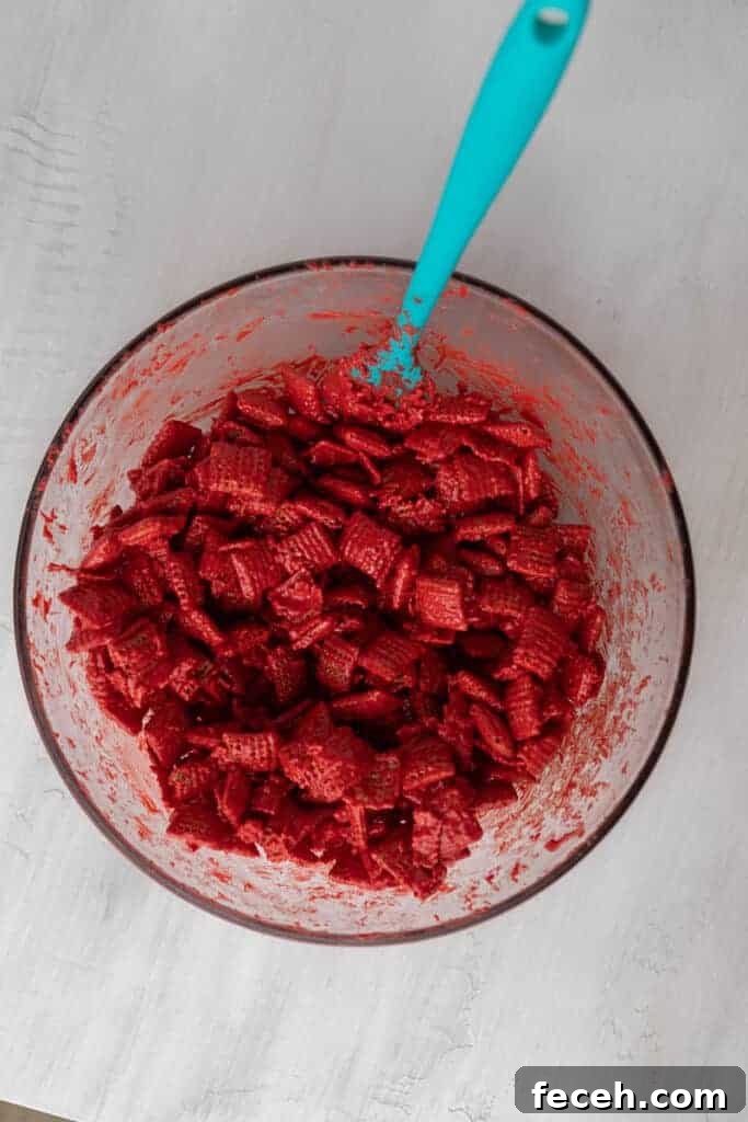 Red candy melt coated Chex cereal for Valentine’s puppy chow