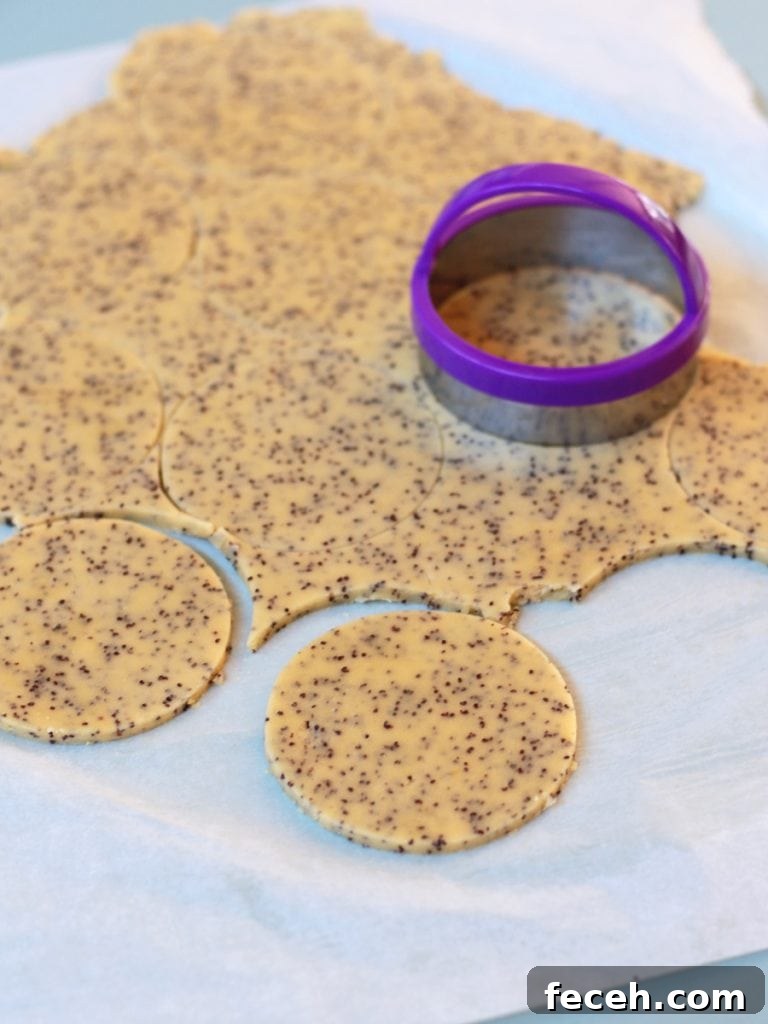 Shaping the cookies with a cookie cutter
