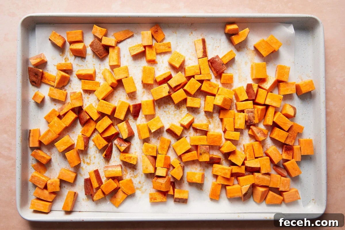 Close-up of roasted sweet potatoes and sausage