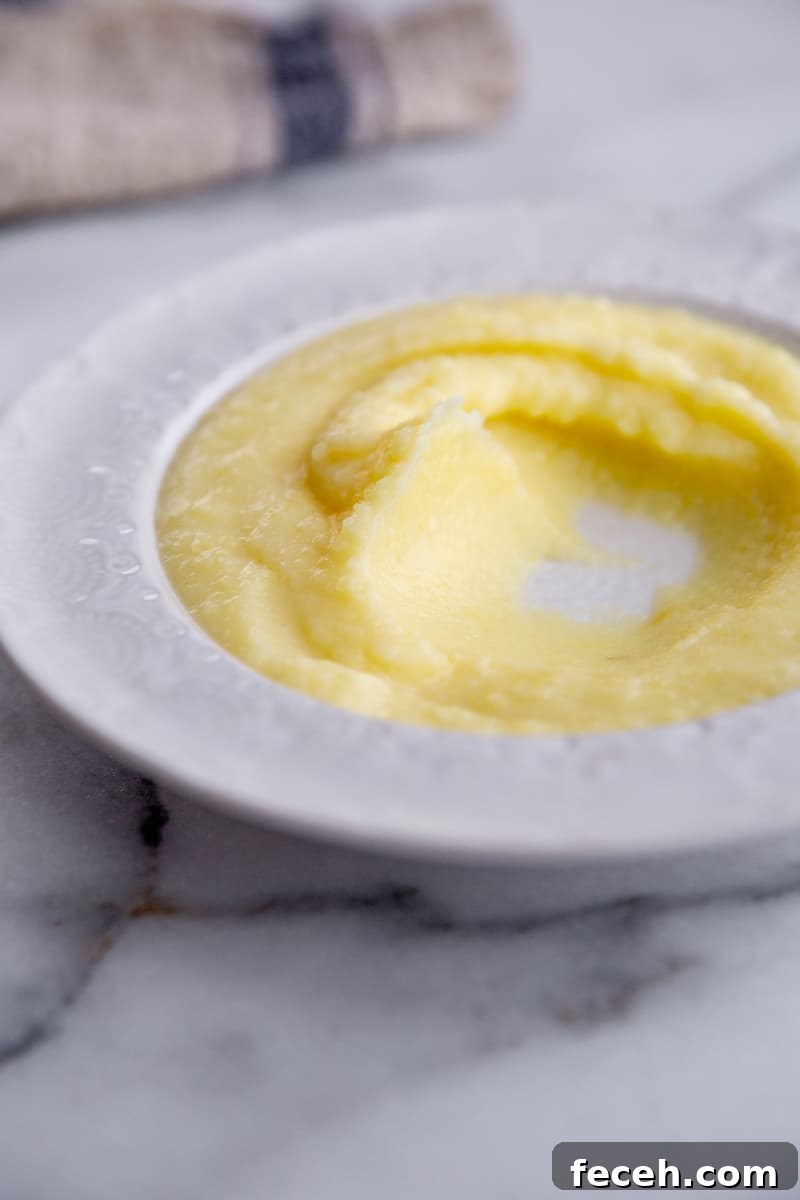 A swirl of pomme puree in a serving bowl. 