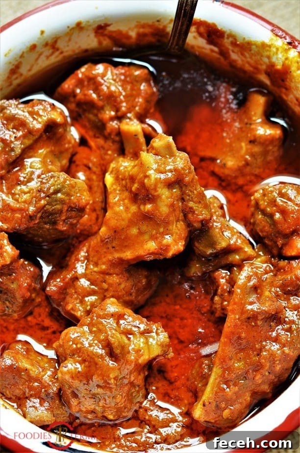 Junglee Maas in a spicy rich red gravy