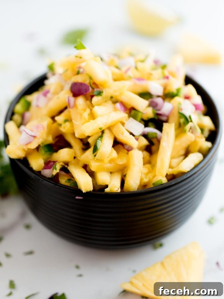 Pineapple Pico de Gallo: Fresh Tropical Salsa Recipe 2 pineapple pico de gallo in a block bowl