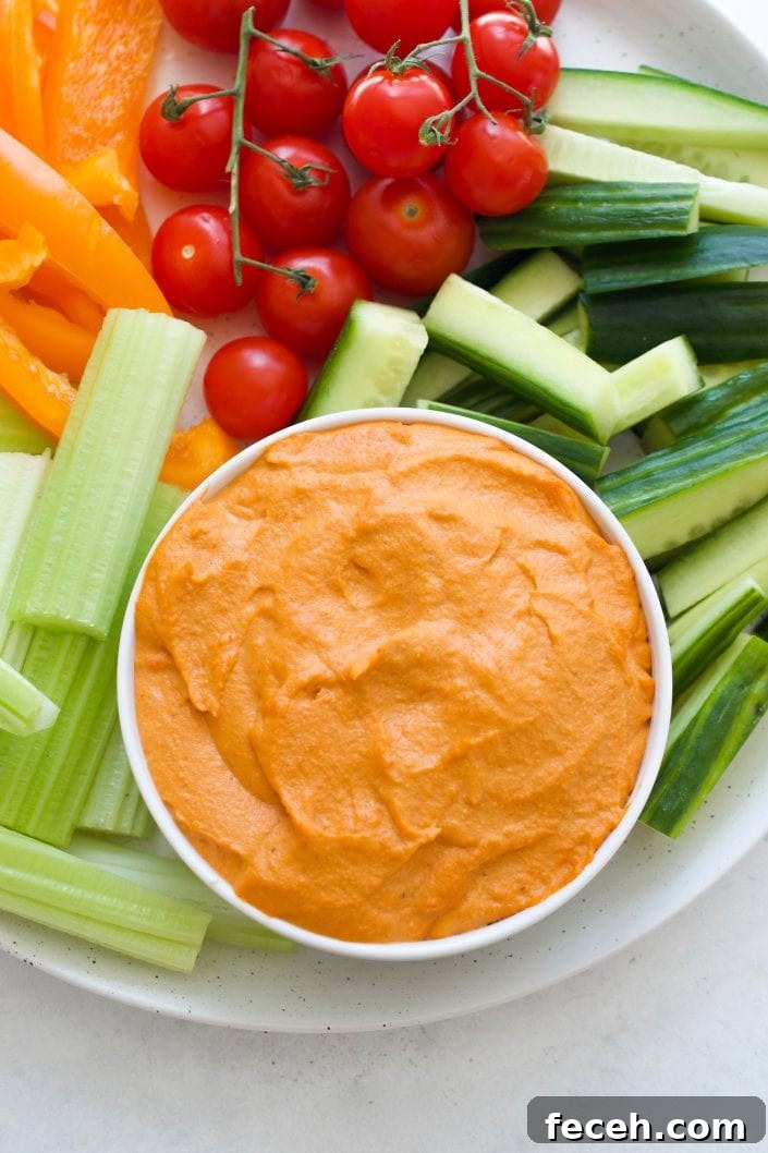 Red pepper dip served with veggies