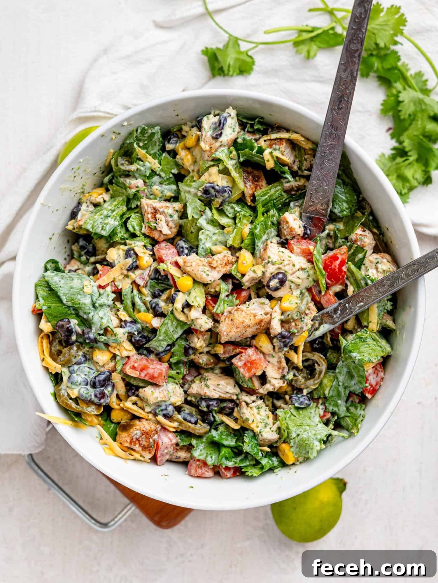 Mexican Chicken Salad ingredients in a large white salad bowl.