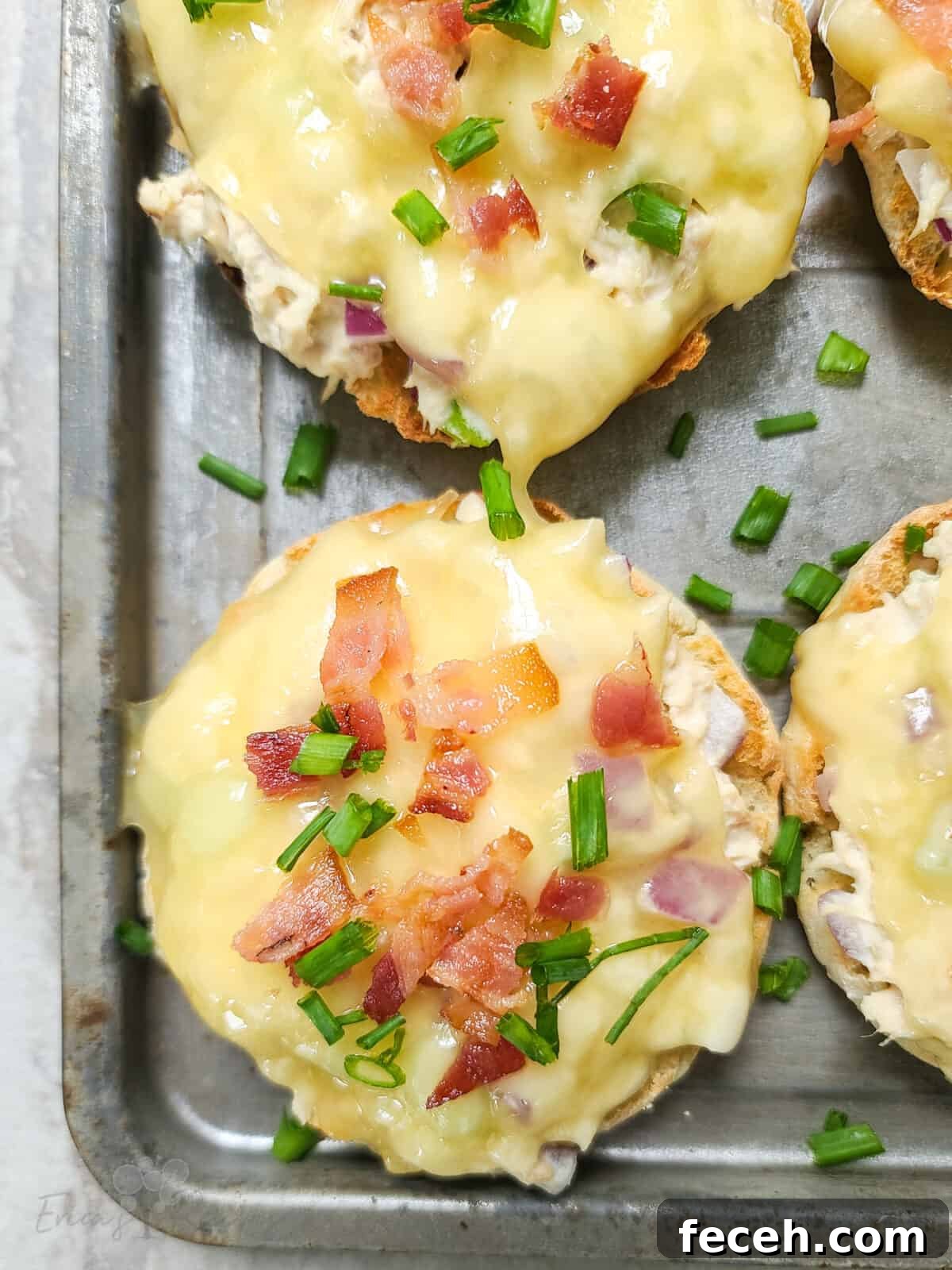 Bacon-Topped Open-Faced Tuna Melt Recipe 3 finished tuna melt on bake sheet