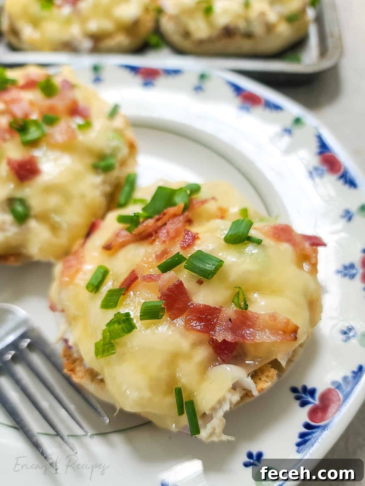 Bacon-Topped Open-Faced Tuna Melt Recipe 6 portion of prepared recipe on plate with fork