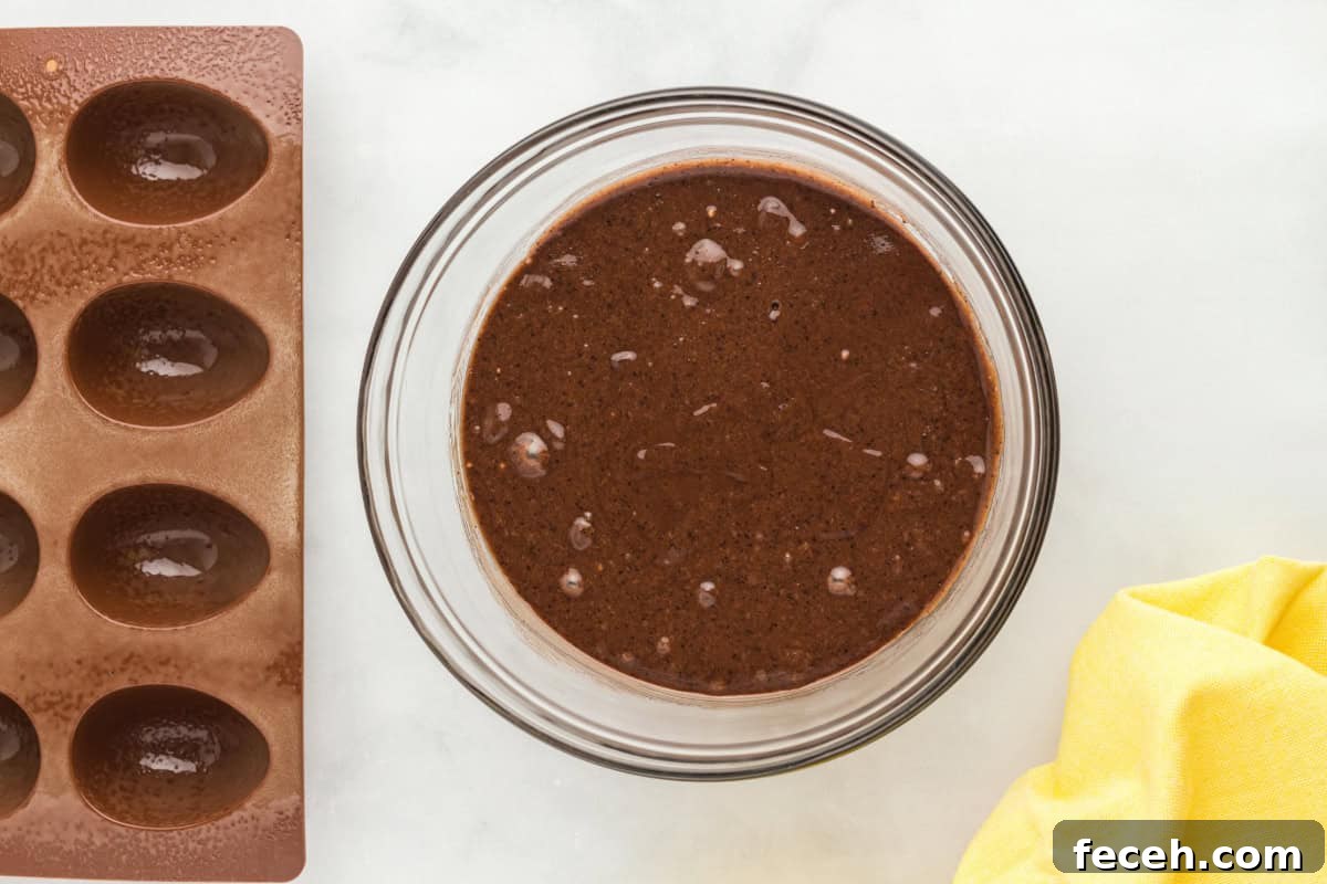 brownie batter in a glass bowl.