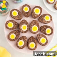 12 creme egg brownies arranged like deviled eggs on a circular tray.