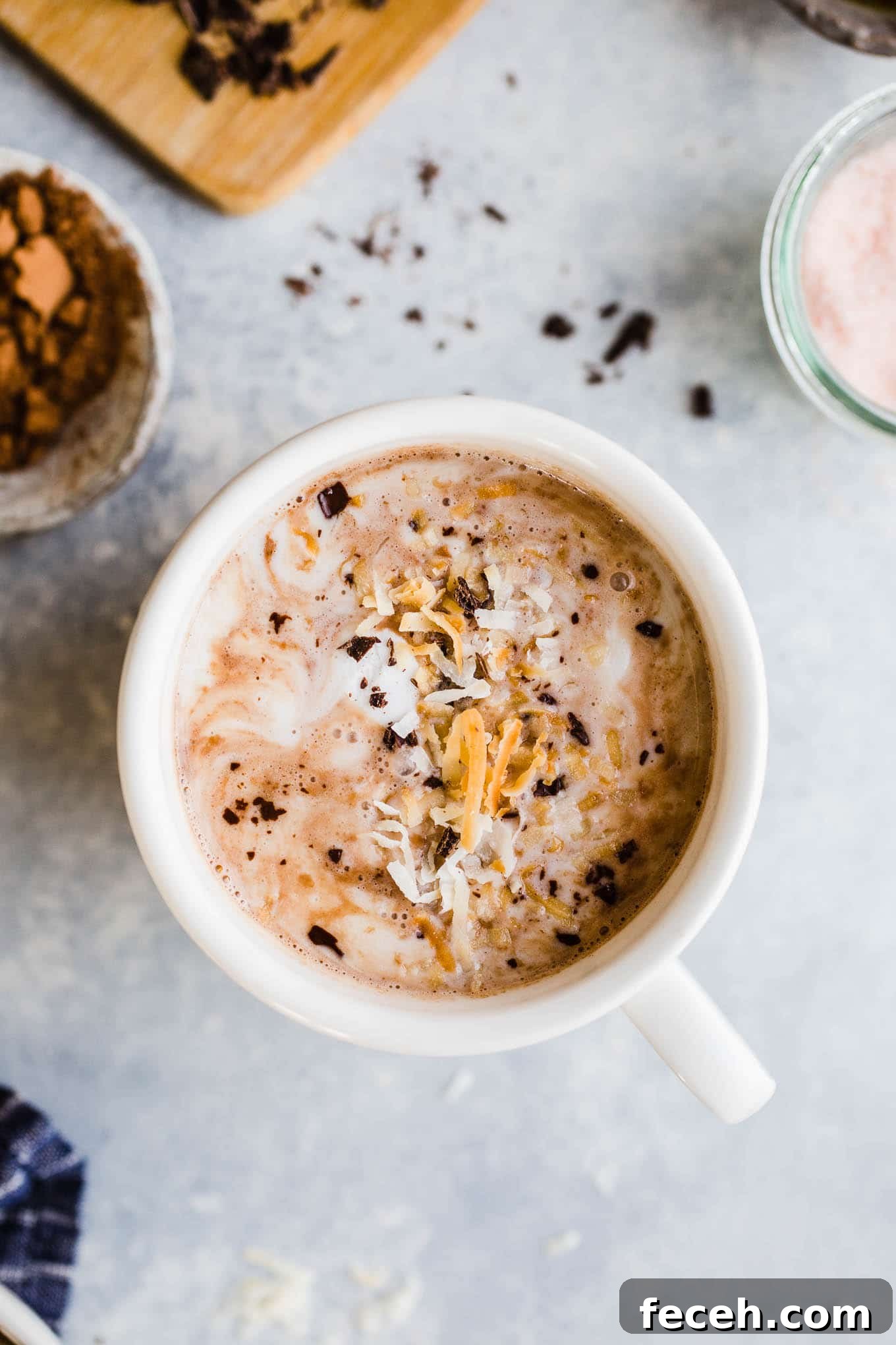 Toasted Coconut Vegan Hot Chocolate Recipe — Cozy Dairy-Free Cocoa 4 Toasted coconut hot chocolate topped with coconut whipped cream, chocolate shavings, and toasted coconut.