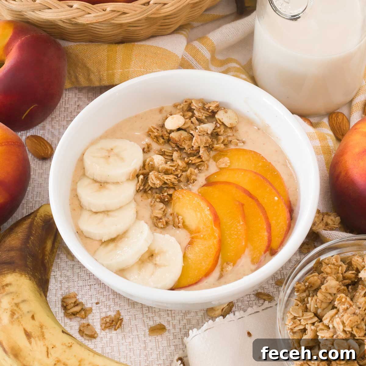 Peach Banana Smoothie Bowl topped with Vanilla Almond Granola 2 How to make the BEST-TASTING healthy peach banana smoothie bowl w/ vanilla almond granola all naturally sweetened. For high protein & energy!