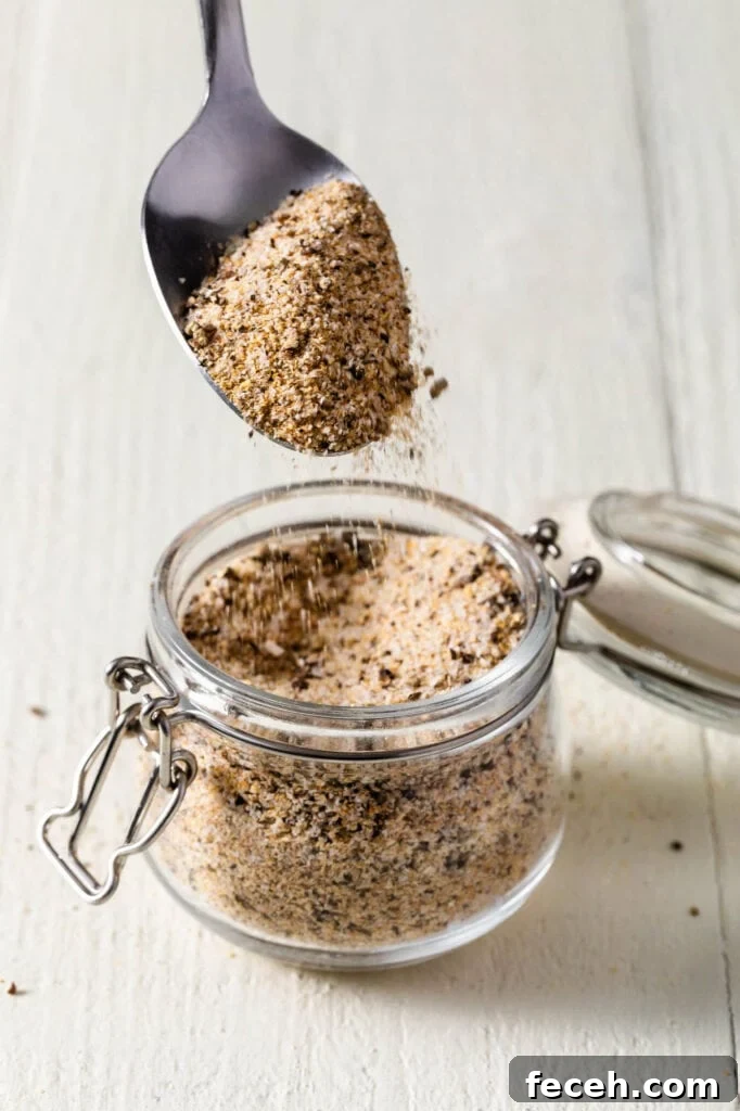 scooping soul food seasoning with a spoon 