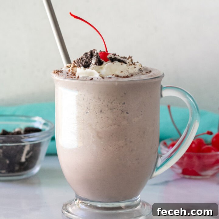 cookies and cream milkshake in a clear glass