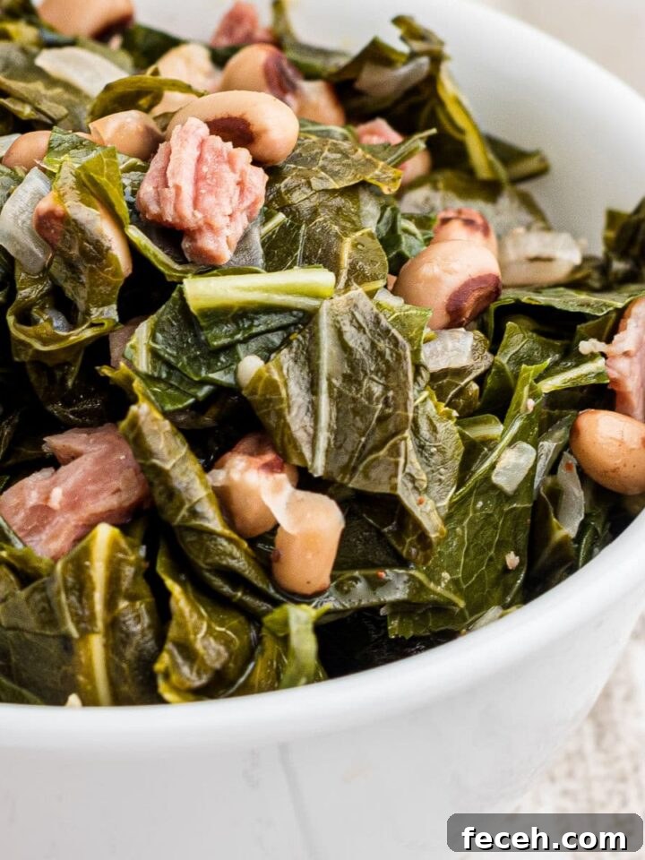 Close up of a bowl of southern black eyed peas and collard greens.