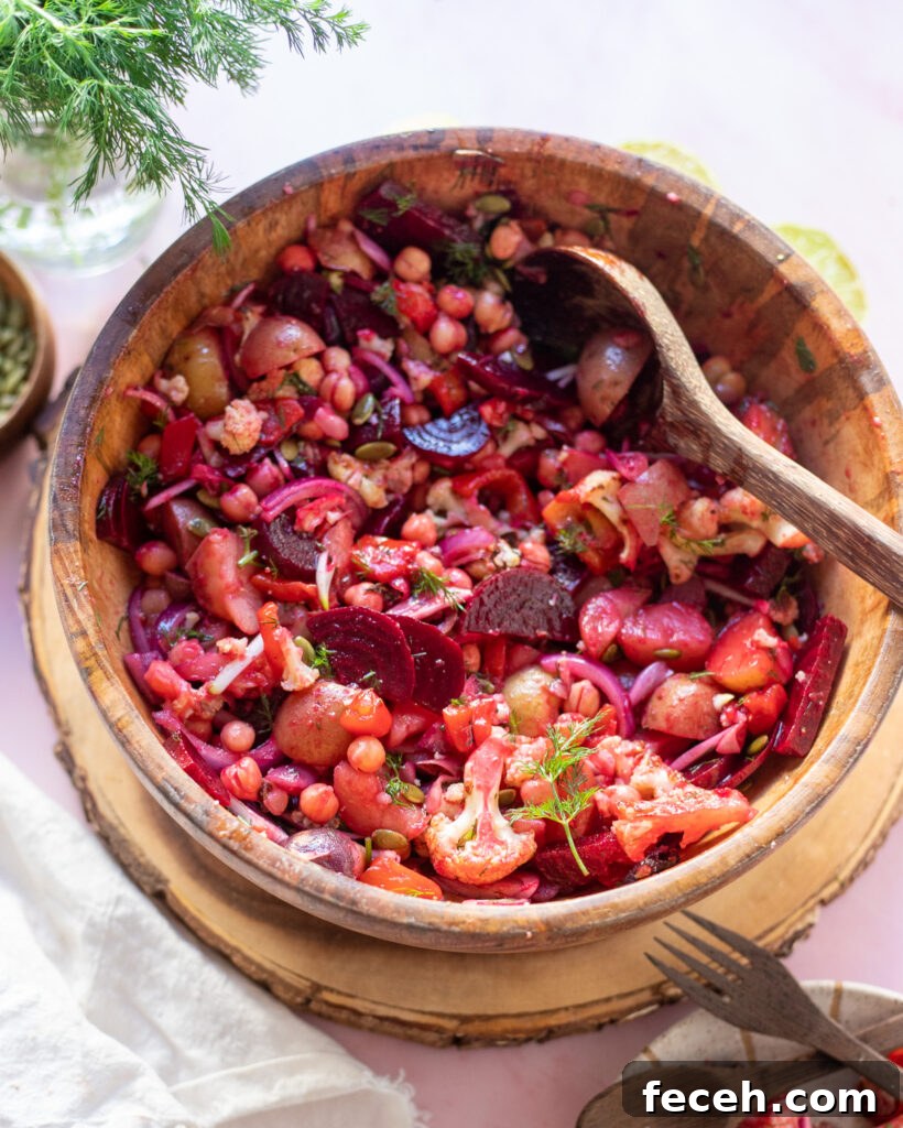rainbow salad in wooden mixing bowl