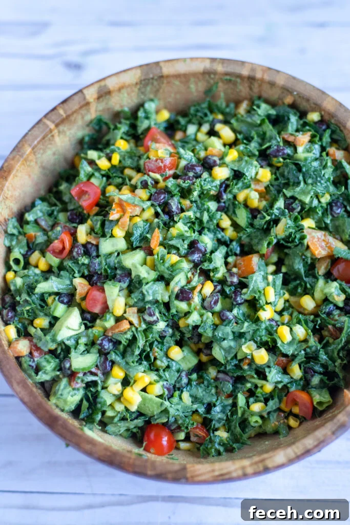 image kale and bean salad in a wooden serving bowl.