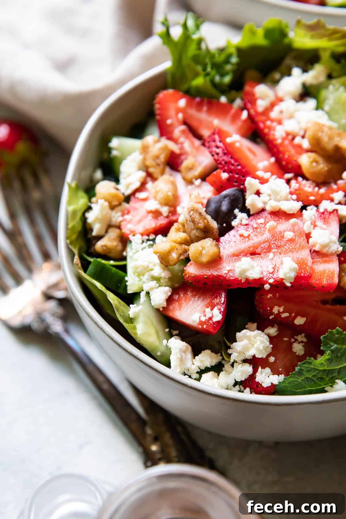Strawberry feta salad in a bowl.