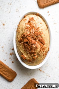 top down shot of biscoff baked oats with biscoff cookie crumbles